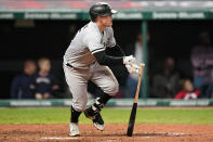 Chicago White Sox's Andrew Vaughn hits a two-run single in the sixth inning in the second baseball game of a doubleheader against the Cleveland Indians, Thursday, Sept. 23, 2021, in Cleveland. (AP Photo/Tony Dejak)