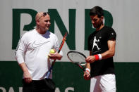 Tennis - French Open - Roland Garros - Paris - 25/05/2017. Novak Djokovic of Serbia and his coach Andre Agassi during a training session. REUTERS/Benoit Tessier