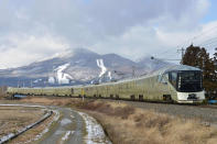 <p>East Japan Railway’s Train Suite Shiki-shima is shown during a training run in Inawashiro, Fukushima prefecture. (Photo: STR/AFP/Getty Images) </p>