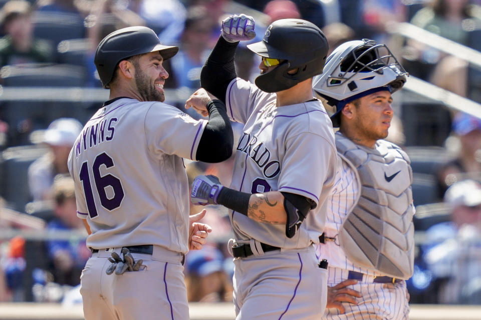 Colorado Rockies' Brenton Doyle, right, celebrates his two-run home run with Austin Wynns (16) in the fifth inning of a baseball game against the New York Mets, Sunday, May 7, 2023, in New York. (AP Photo/John Minchillo)