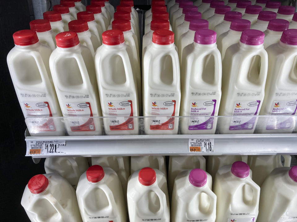 Shown are milk jugs at a grocery store in Roslyn, Pa., Tuesday, June 15, 2021. Wholesale prices, boosted by rising food costs, increased 0.8% in May, and are up by a record amount over the past year, another indication that inflation pressures are rising since the economy has begun to re-open following the pandemic lockdowns. (AP Photo/Matt Rourke)