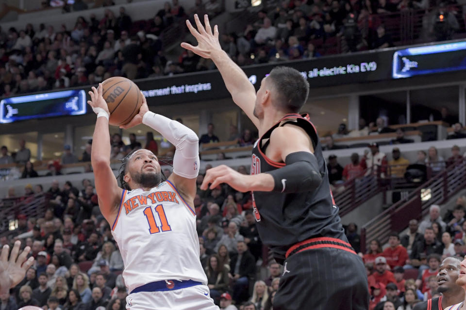 New York Knicks Jalen Brunson (11) breaks through to take a shot against the Chicago Bulls during the second quarter of an NBA basketball game in Chicago, Friday, April 5, 2024. (AP Photo/Mark Black)