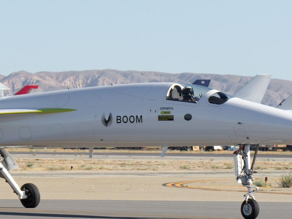 A pilot sitting in the cockpit of the Boom Supersonic experimental aircraft.