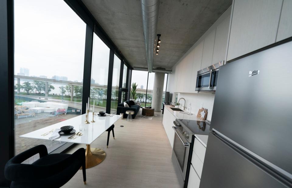 Kitchen and living area of a one bedroom corner in The Residences at Water Square on the former site of the Joe Louis Arena on Tuesday, June 27, 2023.  