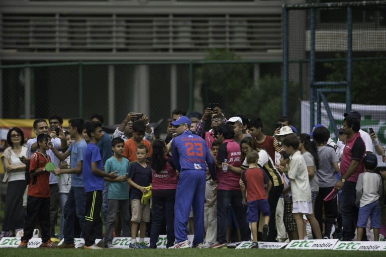 Michael Clarke of the Kowloon Cantons signs autographs for fans during the Hong Kong T20 Blitz tournament, in May 2016
