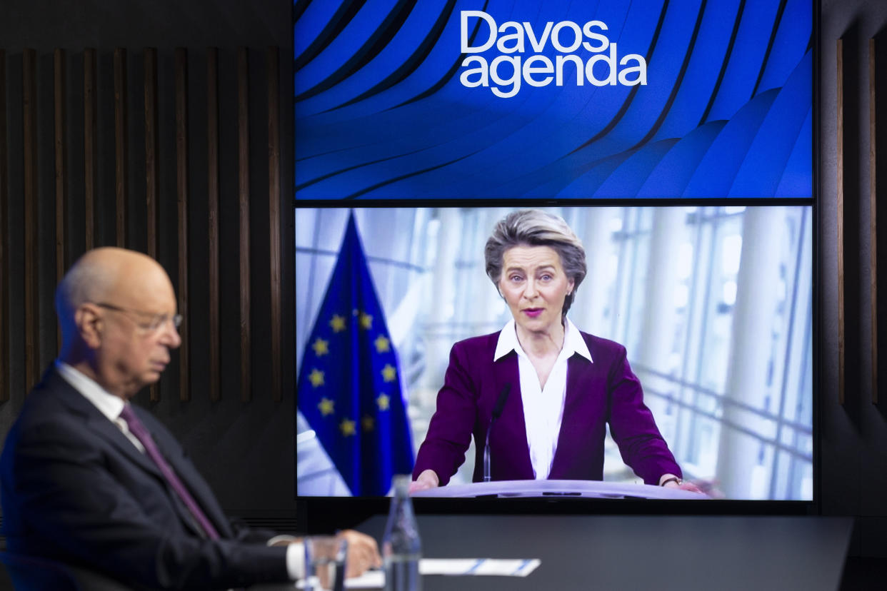 German Klaus Schwab, left, Founder and Executive Chairman of the World Economic Forum, WEF, listens to European Commission President Ursula von der Leyen, displayed on a video screen, during a conference at the Davos Agenda in Cologny near Geneva, Switzerland, Tuesday, Jan. 26, 2021. The Davos Agenda from Jan. 25 to Jan. 29, 2021 is an online edition due to the coronavirus disease (COVID-19) outbreak. (Salvatore Di Nolfi/Keystone via AP)