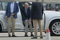 Spain's former King Juan Carlos gets into a car on arrival by private jet at the Peinador airport in Vigo, north western Spain, Thursday, May 19, 2022. Spain's former King has returned to Spain Thursday for his first visit since leaving nearly two years ago amid a cloud of financial scandals. (AP Photo/Lalo R. Villar)