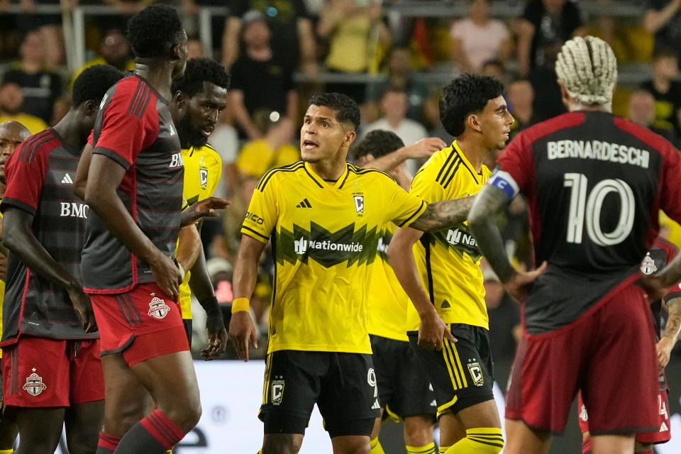 Crew forward Cucho Hernandez gets into an argument with Toronto forward Deandre Kerr on Saturday.