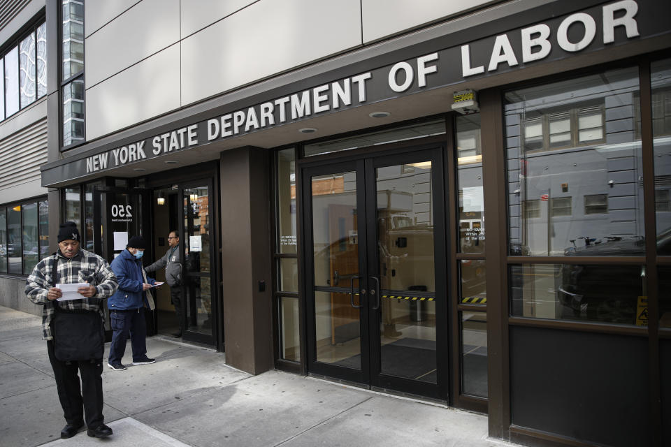 Visitors to the Department of Labor are turned away at the door by personnel due to closures over coronavirus concerns, Wednesday, March 18, 2020, in New York. Mayor Bill de Blasio said New York City residents should be prepared for the possibility of a "shelter in place" order within days. De Blasio said Tuesday no decision had been made yet, but he wants city and state officials to make a decision within 48 hours given given the fast spread of the coronavirus. (AP Photo/John Minchillo)