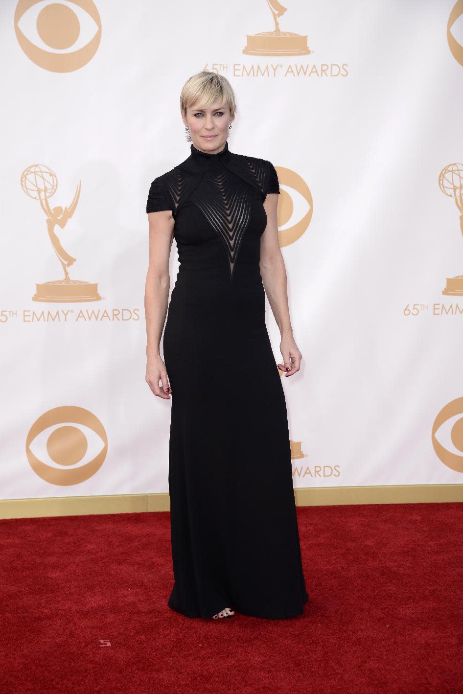 Robin Wright, wearing Ralph Lauren, arrives at the 65th Primetime Emmy Awards at Nokia Theatre on Sunday Sept. 22, 2013, in Los Angeles. (Photo by Dan Steinberg/Invision/AP)