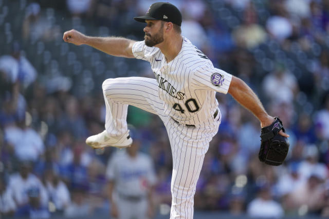 Dodgers split doubleheader, hand Rockies their 100th loss of