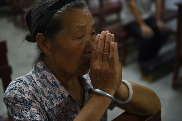 A parishioner pictured during Mass at the Catholic church in Dingan, China's southern Guangxi region