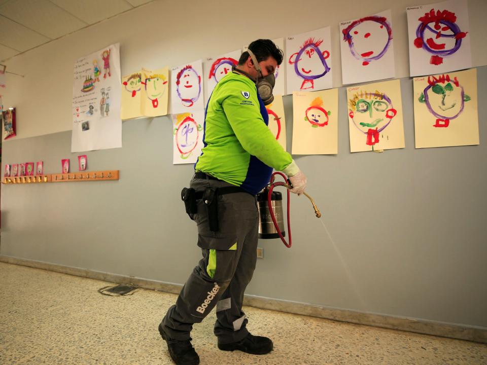  An employee from a disinfection company sanitizes a closed school, as a precaution against the spread of the coronavirus, in Sidon, Lebanon February 29, 2020. REUTERS:Ali Hashisho.JPG