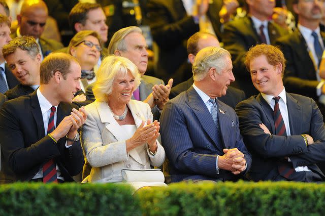 <p>Dave J Hogan/Getty</p> (From left) Prince William, Queen Camilla, King Charles and Prince Harry at the opening ceremony of the at Olympic Park on Sept. 10, 2014 in London.