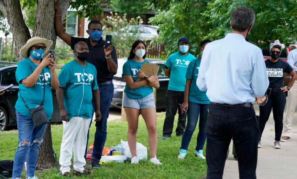 Texas Organizing Project volunteers listen to Beto O’Rourke speak before a neighborhood walk in West Dallas Wednesday, June 9, 2021. (AP Photo/LM Otero)