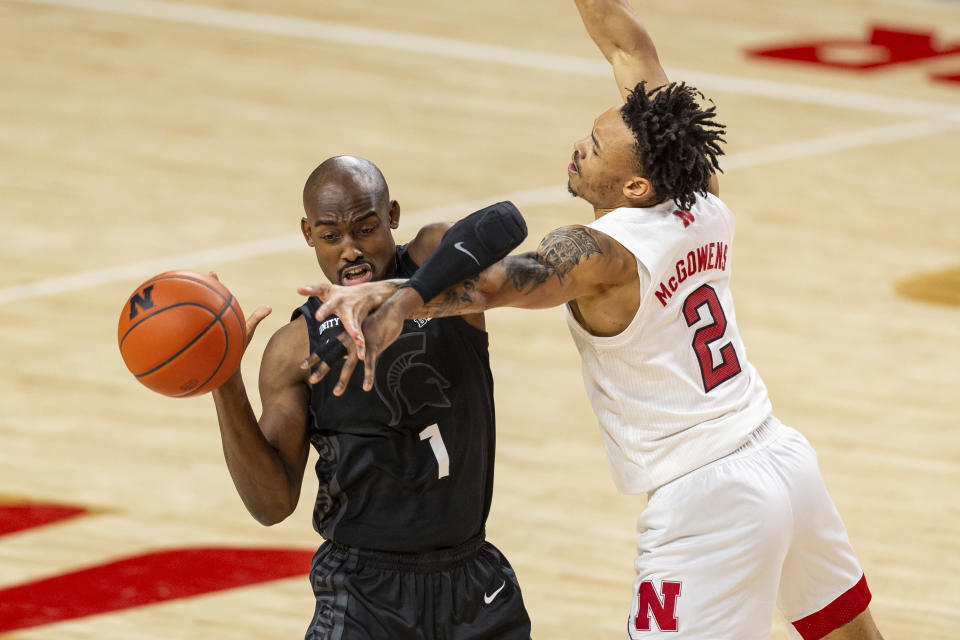 Michigan State guard Joshua Langford (1) fights off Nebraska guard Trey McGowens (2) reaching for the ball in the first half during an NCAA college basketball game on Saturday, Jan. 2, 2021, in Lincoln, Neb. (AP Photo/John Peterson)