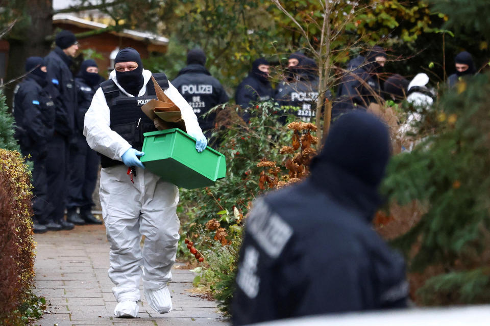 Police secure an area in Berlin after 25 suspected members and supporters of a far-right group were detained during raids across Germany, Dec. 7, 2022.<span class="copyright">Christian Mang—Reuters</span>