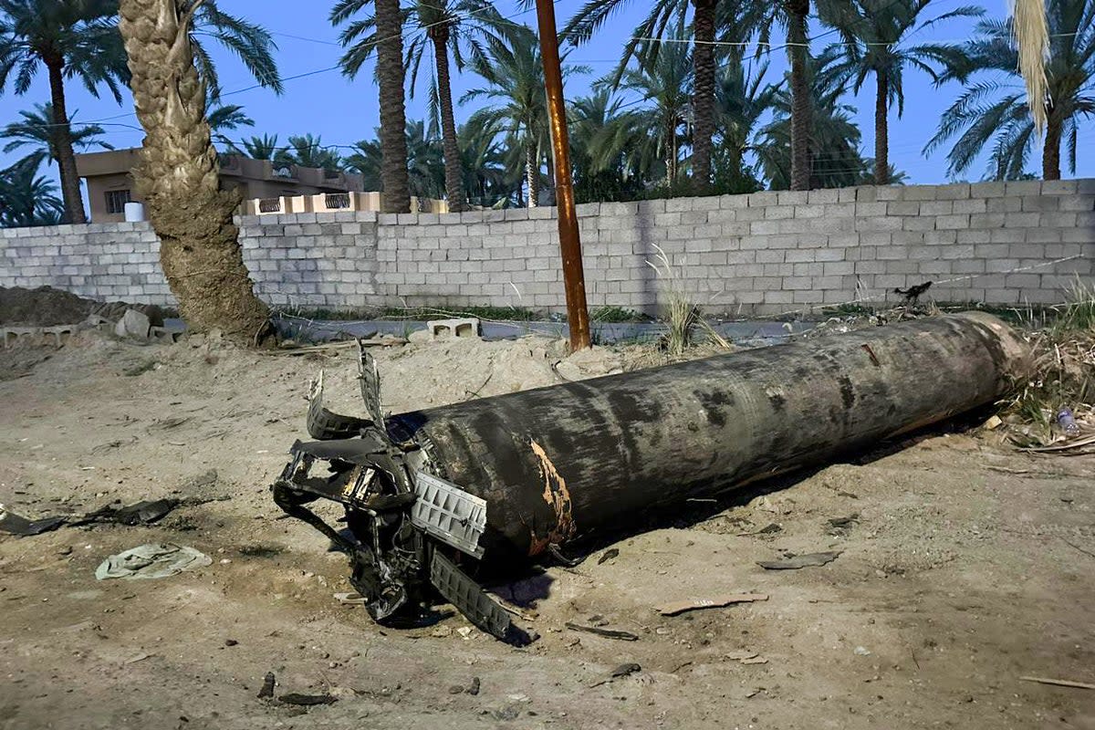 A fragment of a missile fell on an empty field during the Iranian airstrikes against Israel in Baghdad, Iraq (Anadolu via Getty Images)
