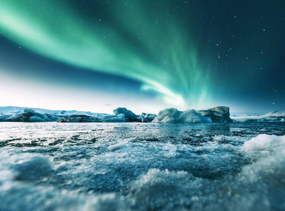 White ice contrasts with the Aurora Borealis in Jokulsarlon (Getty Images)