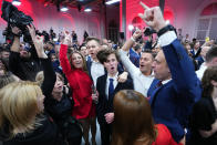 Supporters of Donald Tusk, a former Polish prime minister celebrate at his party headquarters in Warsaw, Poland, Sunday, Oct. 15, 2023. Poland's election result is on a knife edge as an exit poll says that the governing Law and Justice party won the most votes. (AP Photo/Petr David Josek)