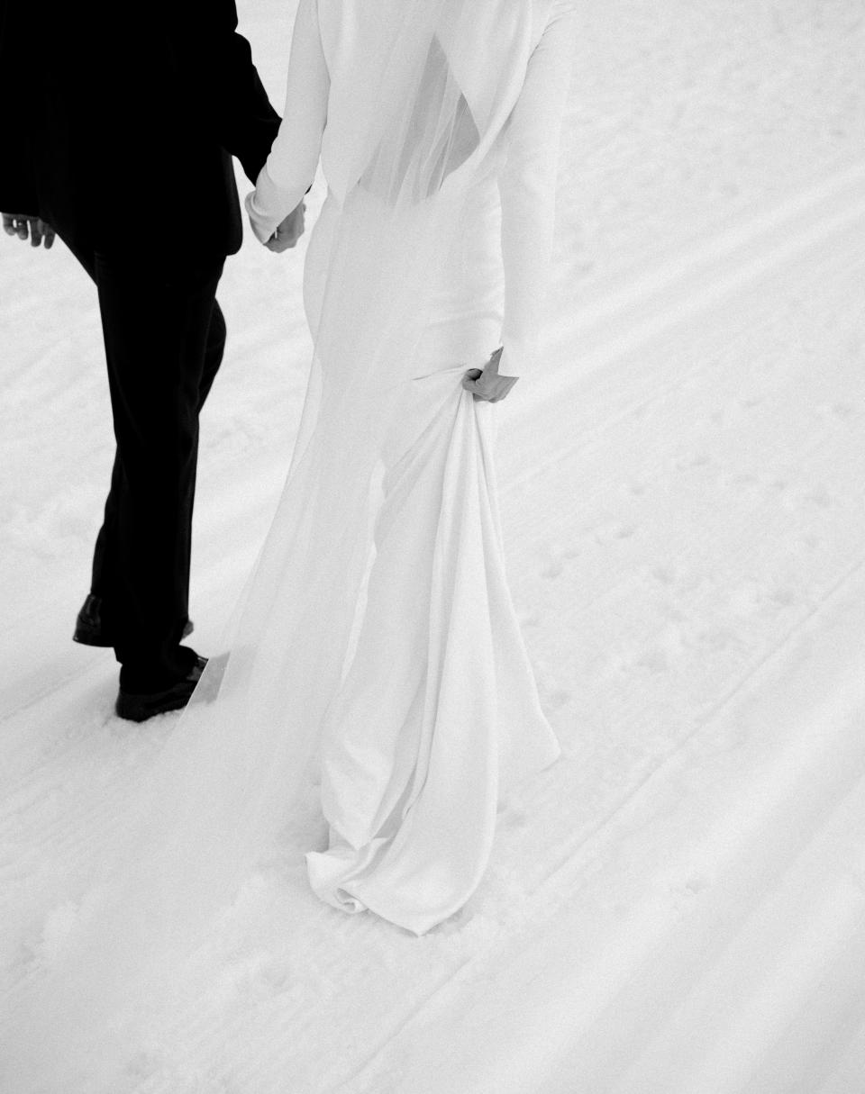 When Otto and James caught up with us after the ceremony. My gossamer silk veil was so delicate I eventually had to take it off so as to preserve it. I loved the juxtaposition of the weightless, airy silk next to the heavier double-face silk charmeuse of my dress. It was a last-minute suggestion by Thakoon, so we had a few yards overnighted from Switzerland, and Sheila Milne from <a href="https://www.instagram.com/aspenstitchworks/?hl=en" rel="nofollow noopener" target="_blank" data-ylk="slk:Aspen Stitchworks;elm:context_link;itc:0;sec:content-canvas" class="link ">Aspen Stitchworks</a> did an incredible job cutting it and attaching it to a comb the day before the wedding. Thankful it came together!