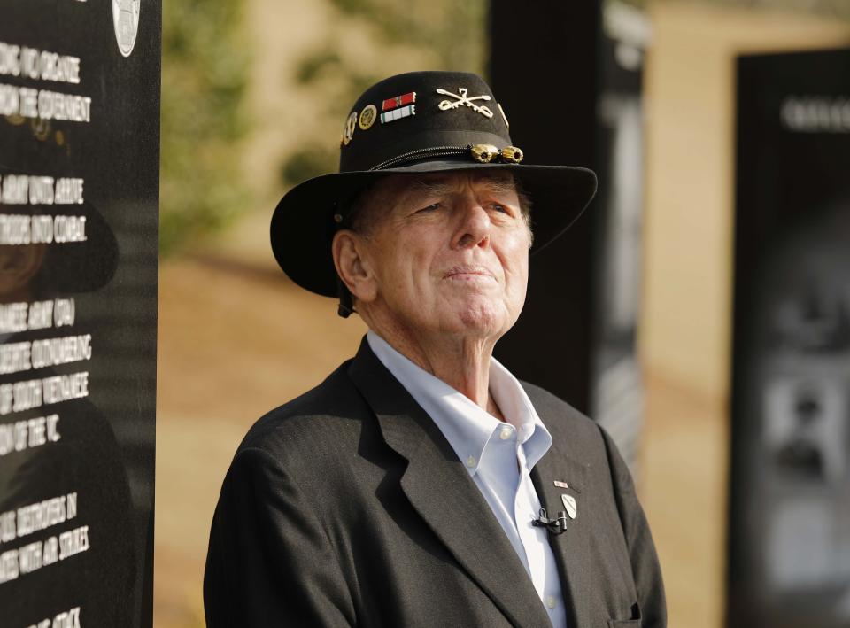 FILE - Author Joe Galloway talks to reporters after services for retired Lt. Gen. Hal Moore, Friday, Feb. 17, 2017, in at Fort Benning, Ga. Galloway, best known for his book recounting a pivotal battle in the Vietnam War that was made into a Hollywood movie, has died. He was 79. His wife, Grace Galloway, confirmed to AP that he died Wednesday morning after being hospitalized near their home in North Carolina. (Todd J. Van Emst/Opelika-Auburn News via AP)