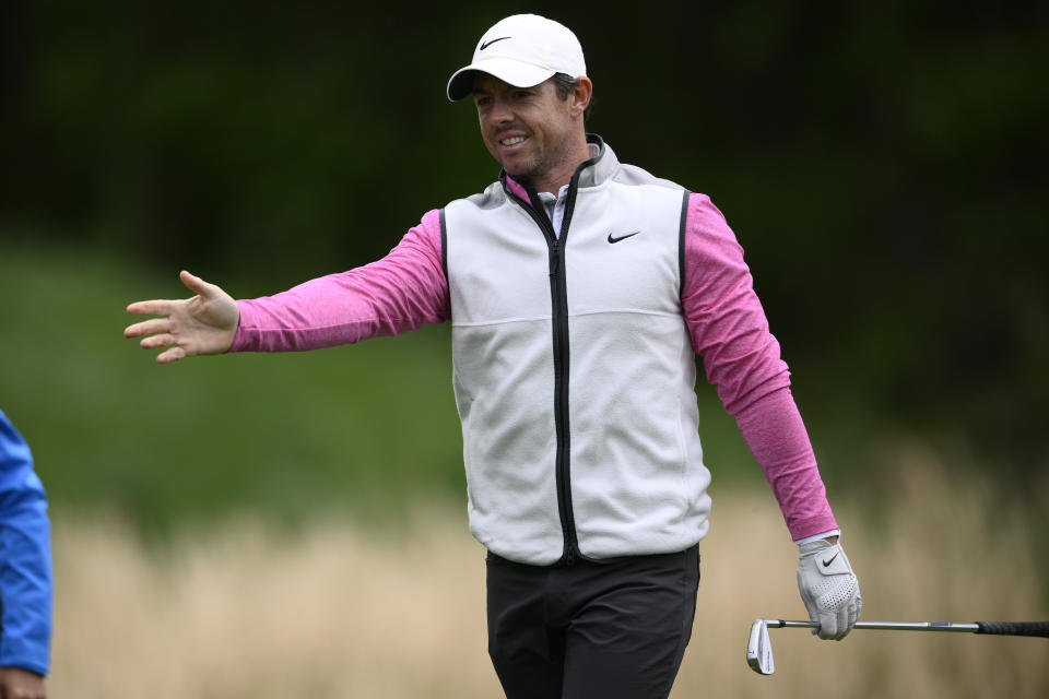 FILE - Rory McIlroy, of Northern Ireland, reacts to his tee shot on the third hole during the final round of the Wells Fargo Championship golf tournament, Sunday, May 8, 2022, at TPC Potomac at Avenel Farm golf club in Potomac, Md. (AP Photo/Nick Wass, File)