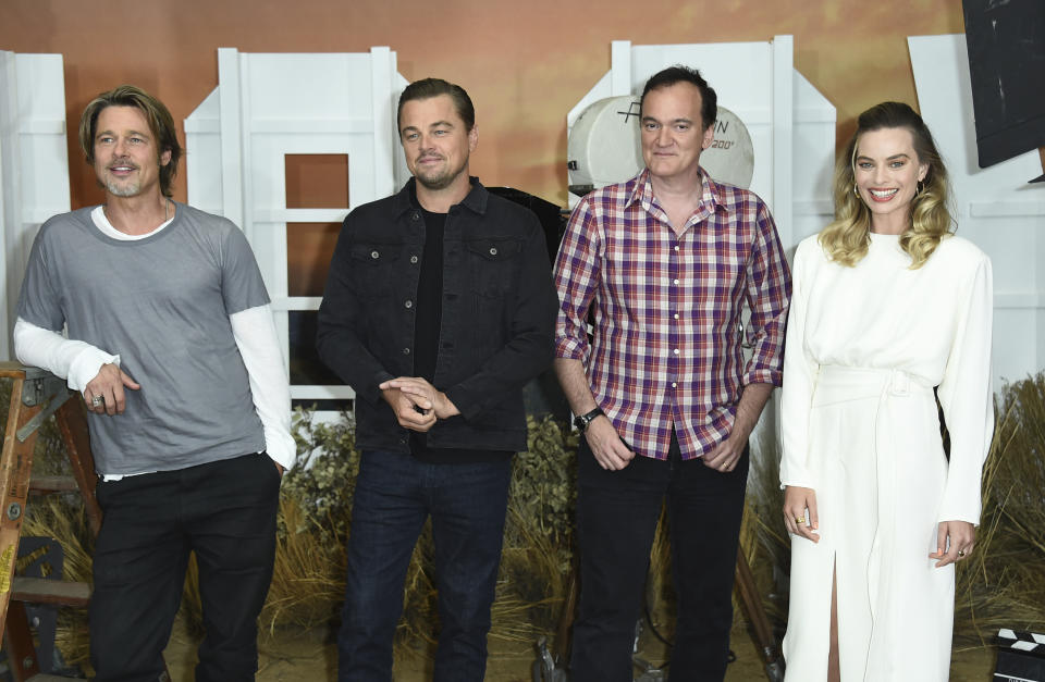 FILE - In this July 11, 2019 file photo, Brad Pitt, from left, Leonardo DiCaprio, Quentin Tarantino and Margot Robbie attend the photo call for "Once Upon a Time in Hollywood" at the Four Seasons Hotel in Los Angeles. The film opens on July 26. (Photo by Jordan Strauss/Invision/AP, File)
