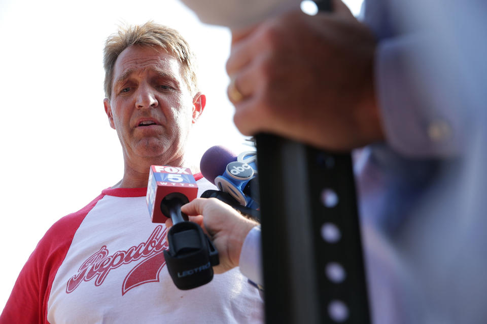 Sen. Jeff Flake (R-Ariz.) briefs members of the media near Eugene Simpson Stadium Park.