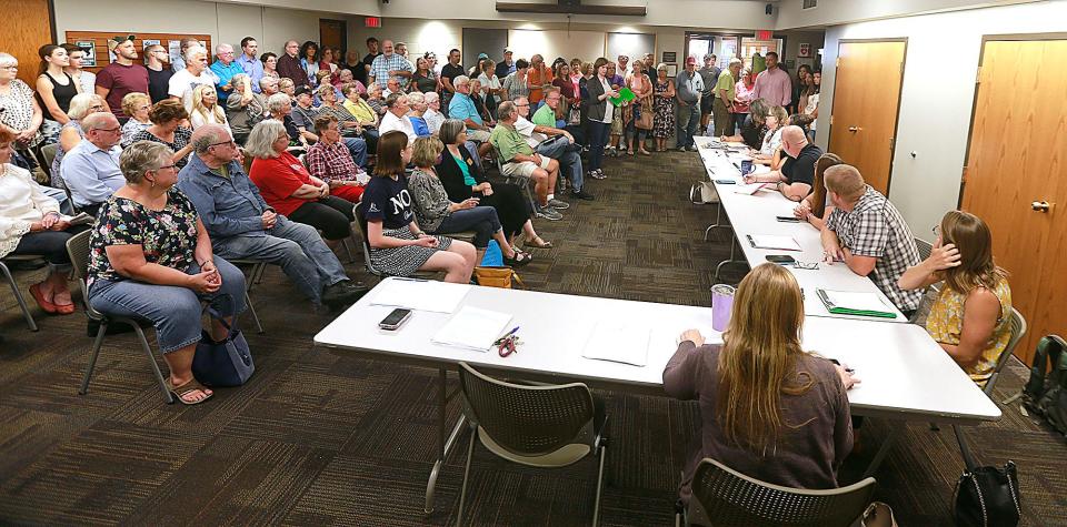 A large crowd attends the July 14 meeting of the Ashland Public Library Board of Trustees to raise concerns about a handful of books they believe should not be readily available to children. TOM E. PUSKAR/ASHLAND TIMES-GAZETTE