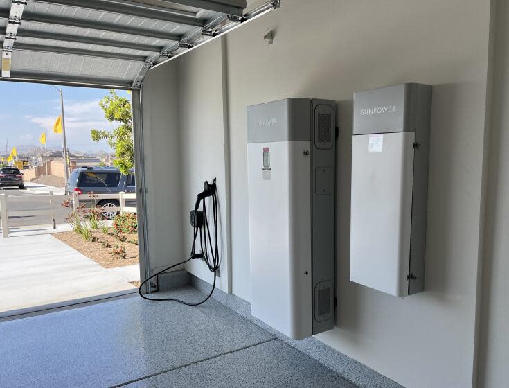 The garage of an all-electric, solar powered home in a new KB Home subdivision in Menifee includes a battery storage system that can power the home during an outage and in the evenings when the cost of electricity from the grid is higher. (Tony Barboza/Los Angeles Times)