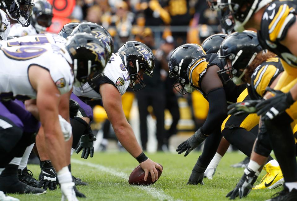 Baltimore Ravens center Tyler Linderbaum (64) prepares to snap the ball gainst the Pittsburgh Steelers during the fourth quarter at Acrisure Stadium.