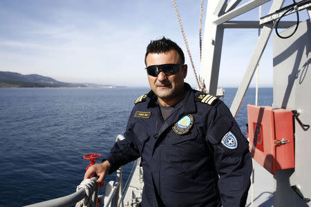 Captain Argyris Frangoulis poses for a photo on the deck of the Agios Efstratios Greek Coast Guard vessel, during a search and rescue patrol at open sea between the Turkish coast and the Greek island of Lesbos, February 8, 2016. Picture taken February 8, 2016. REUTERS/Giorgos Moutafis