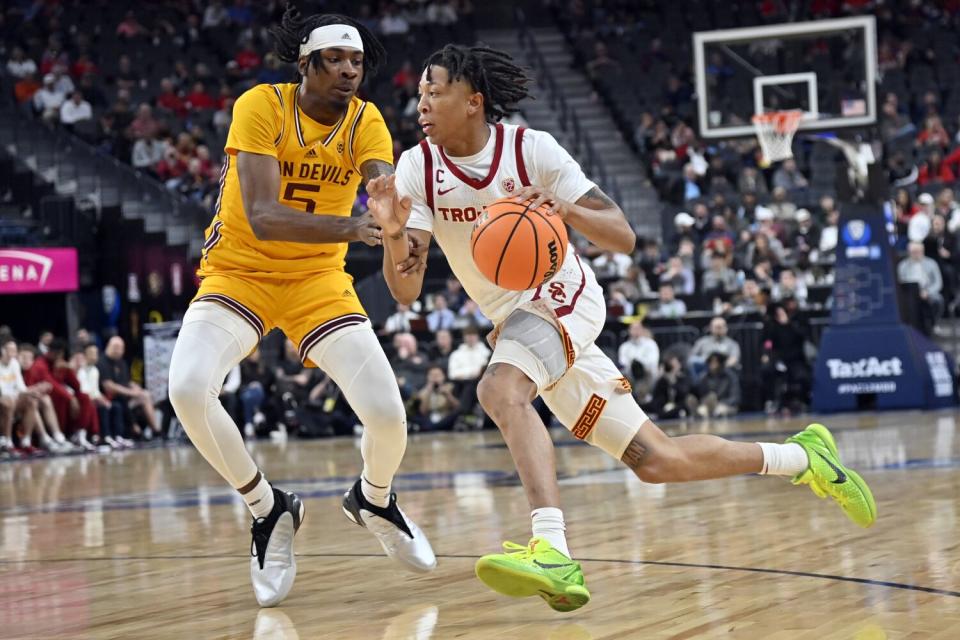 USC guard Boogie Ellis drives against Arizona State forward Jamiya Neal.