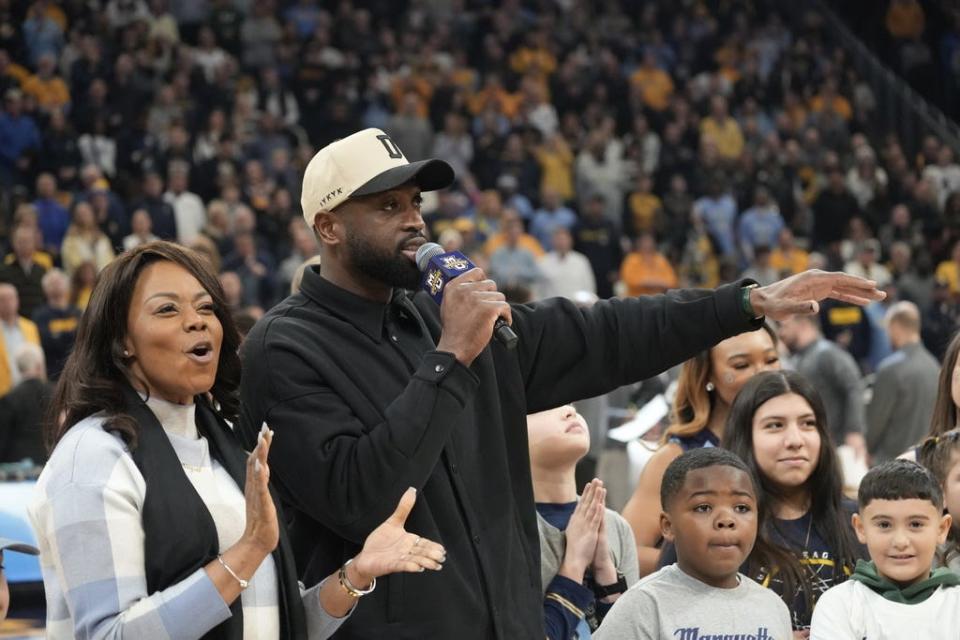 Basketball Hall of Famer Dwyane Wade talks to the crowd after it was announced that he is giving $3 million to Marquette.