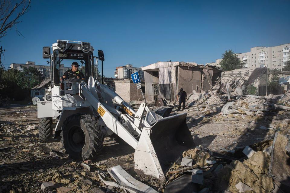 In this photo provided by the Ukrainian Emergency Service, rescuers work on the scene of a building damaged after Russian missile strikes in Pokrovsk (AP)