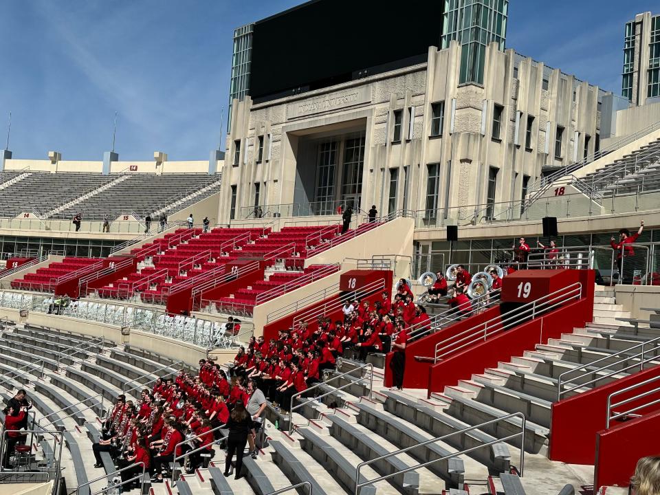 Members of the Marching Hundred erupt with applause as the theme from Star Trek is played at Memorial Stadium on Monday, April 8, 2024.