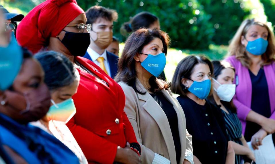 Shruti Parikh, center, head of Education and Political Engagement of North Carolina Asian Americans Together and others listen during a press conference against House Bill 237, the anti-mask and campaign finance bill, outside the Legislative Building in Raleigh, N.C., Tuesday, June 11, 2024.