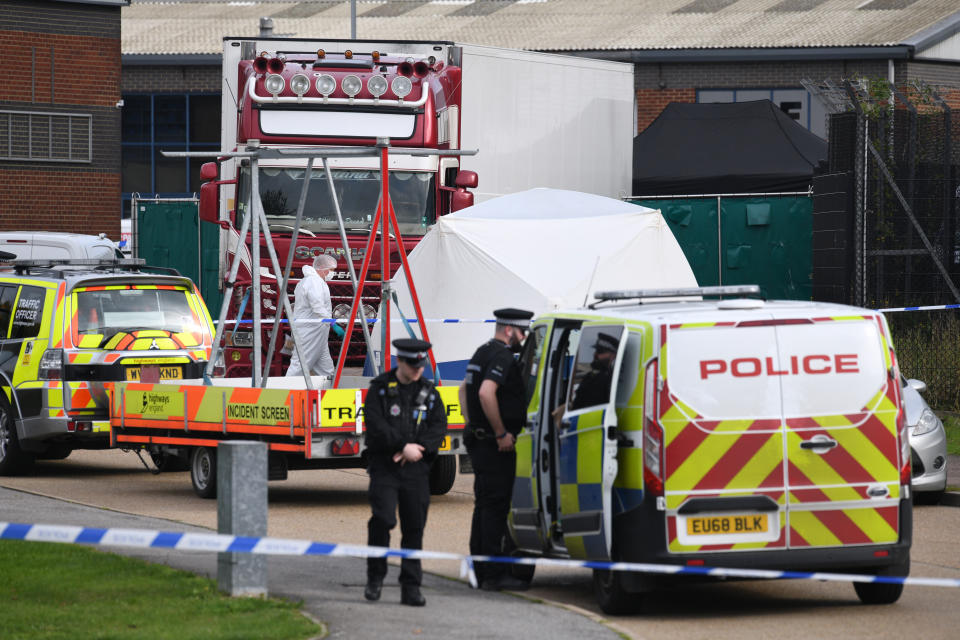 THURROCK, ENGLAND - OCTOBER 23: Police and forensic officers inspect the site where 39 bodies were discovered in the back of a lorry on October 23, 2019 in Thurrock, England. The lorry was discovered early Wednesday morning in Waterglade Industrial Park on Eastern Avenue in the town of Grays. Authorities said they believed the lorry originated in Bulgaria. (Photo by Leon Neal/Getty Images)