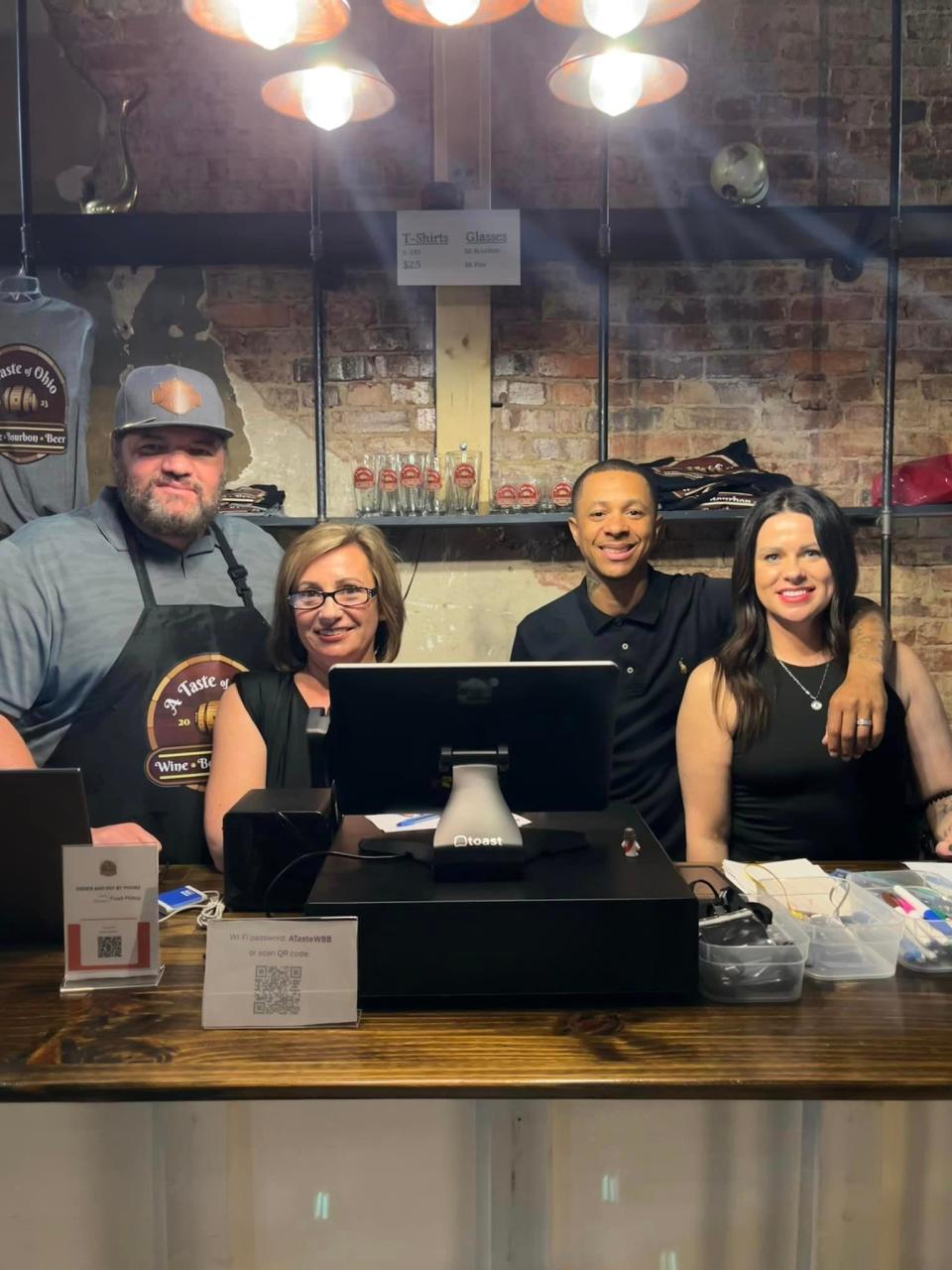 Joseph and Angela Bailey along with Kenneth and Tessa Dickinson, from left, are shown inside A Taste of Ohio, Wine, Bourbon & Beer. The self-serve lounge has been rolling through soft openings but will soon announce its grand opening date on its social media channels.