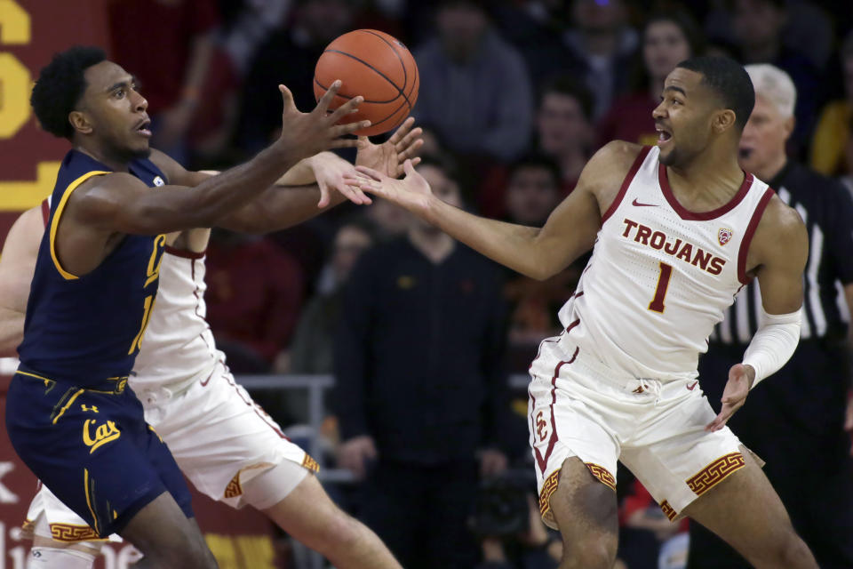 California guard Kareem South, left, and Southern California guard Kyle Sturdivant reach for the ball during the second half of an NCAA college basketball game in Los Angeles, Thursday, Jan. 16, 2020. (AP Photo/Alex Gallardo)