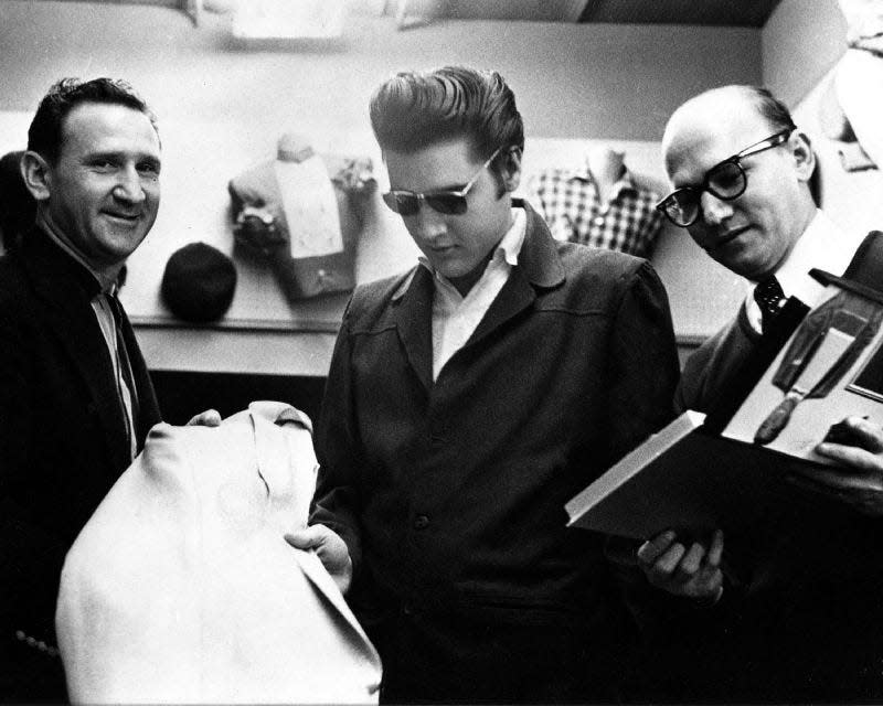 Bernard Lansky, left, and Guy Lansky, right, with Elvis Presley in an undated photograph taken at Lansky Brothers at 126 Beale St. in the 1950s.