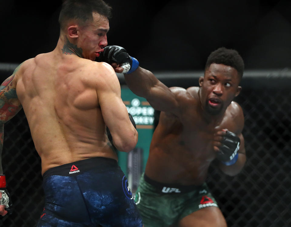 Sodiq Yusuff, right, battles Andre Fili during UFC 246 at T-Mobile Arena. Mandatory Credit: Mark J. Rebilas-USA TODAY Sports