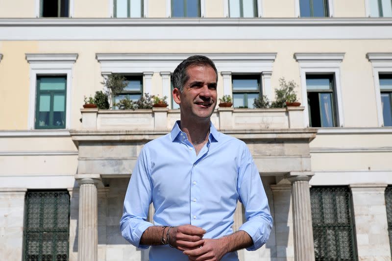 Mayor of Athens Kostas Bakoyannis poses for a picture in front of the town hall, before a statement on the reopening of restaurants, in Athens