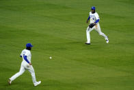 Kansas City Royals shortstop Nicky Lopez, left, center fielder Michael A. Taylor, right, chase a two-run single by Tampa Bay Rays' Yoshi Tsutsugo during the sixth inning of a baseball game Tuesday, April 20, 2021, in Kansas City, Mo. (AP Photo/Charlie Riedel)