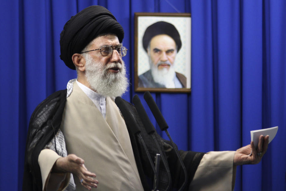 FILE - In this June 19, 2009 file photo, Iran's Supreme Leader Ayatollah Ali Khamenei delivers a sermon with a picture of the late spiritual leader Ayatollah Khomeini in the background, during Friday prayers at the Tehran University campus in Tehran, Iran. Khamenei was among the first and most powerful world leaders to suggest the coronavirus could be a biological weapon created by the U.S. (Meisam Hosseini/Hayat News Agency via AP, File)