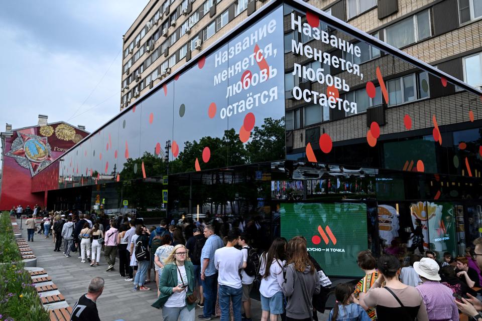 A long line of customers wait outside a Russian version of a former McDonald's outlet.