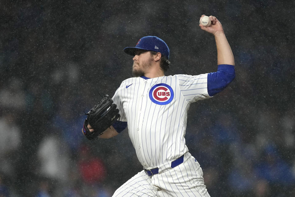 Chicago Cubs starting pitcher Justin Steele delivers in a steady rain during the first inning of the team's baseball game against the Cincinnati Reds on Saturday, June 1, 2024, in Chicago. (AP Photo/Charles Rex Arbogast)