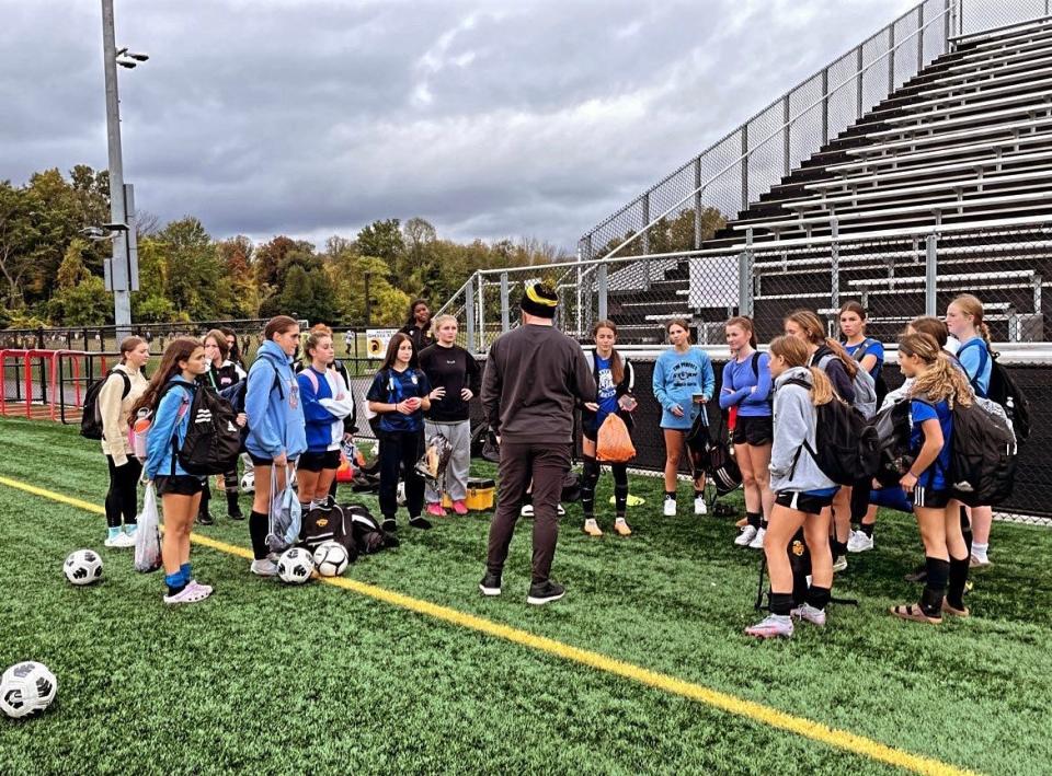 Greece Athena girls soccer coach Jeremiah Bergan talks to his players following a practice ahead of their Section V Class AA first round game against Irondequoit.