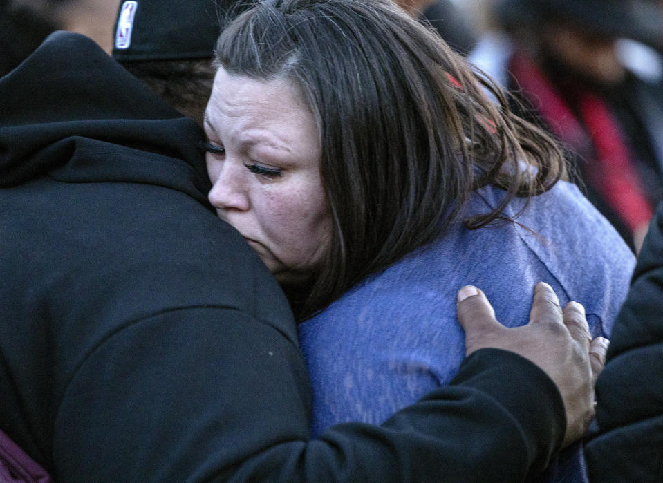 Katie and Aubrey Wright, parents of Daunte Wright, hug at a vigil honoring Daunte Wright, on the one-year anniversary of his death Monday, April 11, 2022, in Brooklyn Center, Minn. Wright was fatally shot by a Minnesota police officer during a traffic stop. (Carlos Gonzalez/Star Tribune via AP)